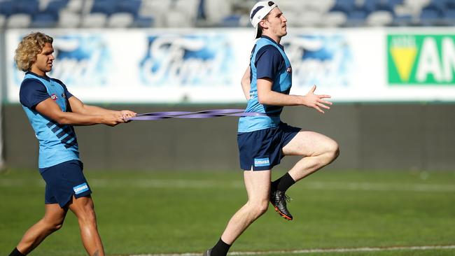 Charlie Constable, right, at Geelong training last season.