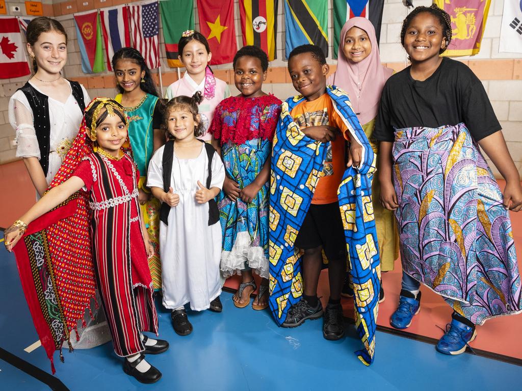 Representing their culture are (from left) Ramona Hamad, Chum Ibrahim, Divyaa Pathmanaban, Erivan Ajo, Hanee Armstrong, Faith Bahati, Dieume Antoine, Ayesha Muktadir and Anna Ndule at Harmony Day celebrations at Darling Heights State School. Picture: Kevin Farmer