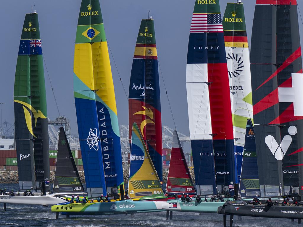 New Zealand SailGP Team helmed by Peter Burling lead Red Bull Italy SailGP Team helmed by Ruggero Tita and the rest of the SailGP fleet on Race Day 1 of the Rolex Los Angeles Sail Grand Prix held in the Port of Los Angeles, California, USA. Saturday 15 March 2025. Rolex SailGP Championship Event 4 Season 2025. Photo: Jason Ludlow for SailGP. Handout image supplied by SailGP