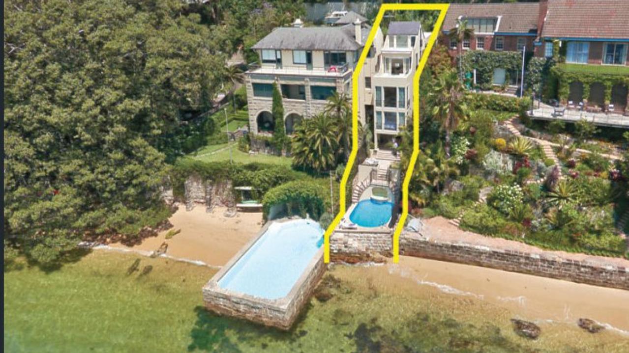 An aerial look at the house with it’s own patch of beach.