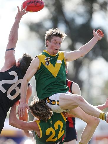 Gippsland Football League Grand Final match between Maffra Eagles and Leongatha Parrots. Maffra became the 2016 premiers, defeating Leongatha 13.10 (88) to 9. 16 (67). Trent Knobel gets a hand to the ball, while Christopher Verboon just misses out and lands on the top of Aaron Hillberg. Picture: Yuri Kouzmin