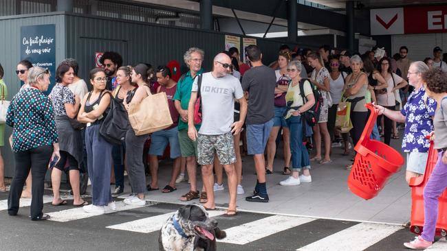 People queue outside a supermarket in Noumea. Delphine Mayeur