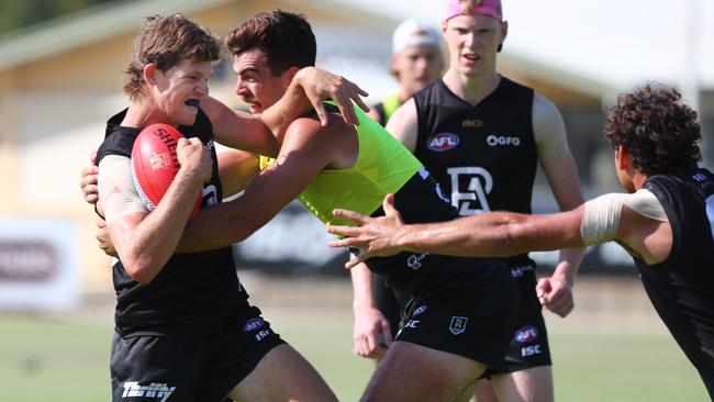 Mitch Georgiades is tackled by Scott Lycett at training. Picture: Tait Schmaal