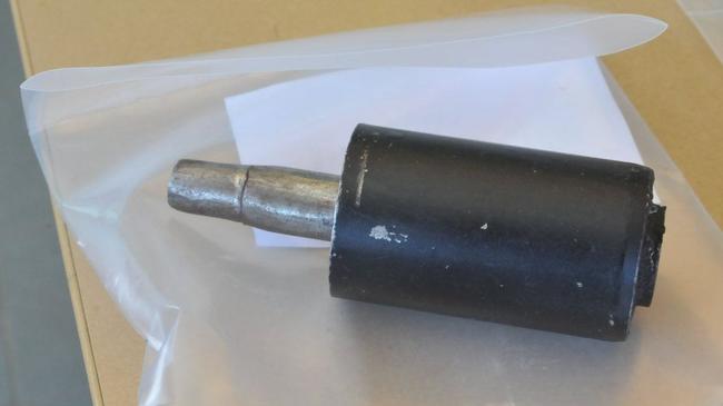 A silencer seized from the home of an accused arm robber. Picture: Frances Klein