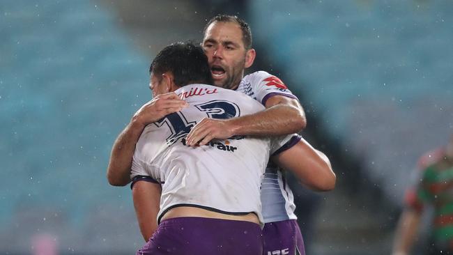 Cameron Smith celebrates a try by Tino Faasuamaleaui. Picture: Brett Costello