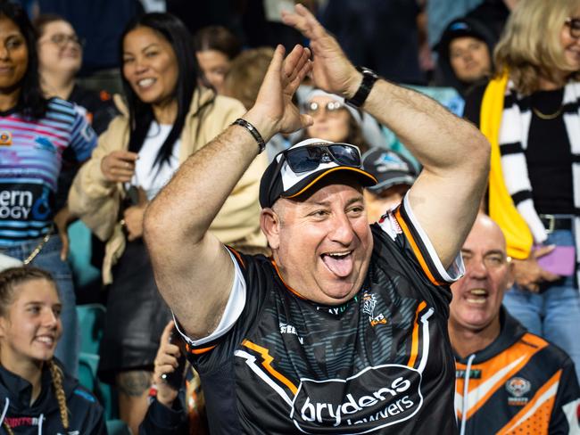 Tigers fans celebrate their teams win over the Sharks. Photo: Tom Parrish