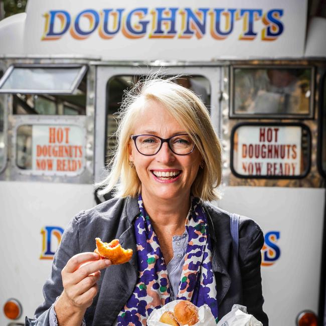 Lord Mayor Sally Capp at the Queen Victoria Market, with the infamous hot jam doughnuts. Picture: Nicole Cleary