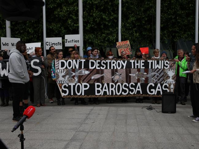 MELBOURNE, AUSTRALIA - NOVEMBER 15: Protesters hold a banner at the front of the Federal Court Of Australia on November 15, 2022 in Melbourne, Australia. The Federal Court is hearing an appeal by Santos Ltd., which seeks to restart drilling in the Barossa Gas project, located near the Tiwi Islands off the northern coast of Australia. Courts had earlier ruled the approval for drilling in the project as invalid. (Photo by Tamati Smith/Getty Images)