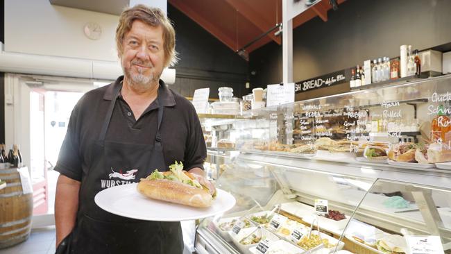 Wursthaus owner Peter Trioli with a salad roll for five of the best. Picture: PATRICK GEE