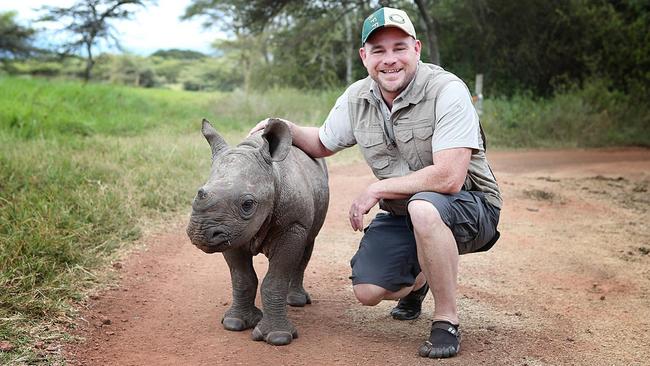 Zarraffa's founder Kenton Campbell with a baby rhino in Kenya.