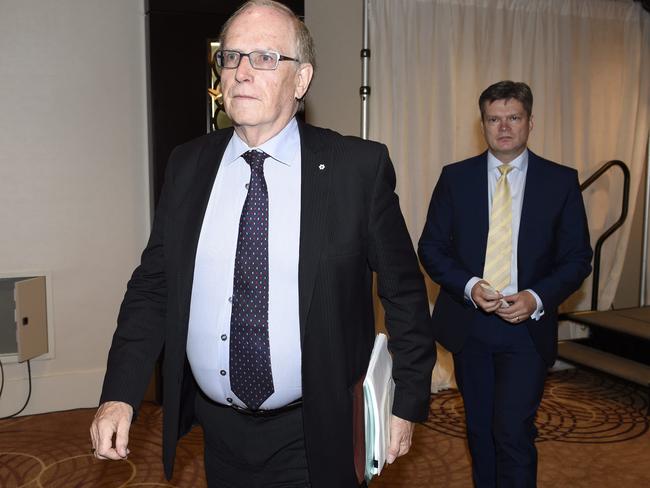 Canadian law professor Richard McLaren, left, and investigator Martin Dubbey, right, leave a news conference after presenting McLaren's findings.