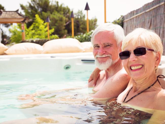 senior couple having a good time at the pool.  Retirees retirement generic.