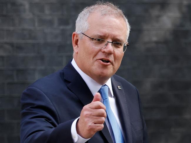 Australia's Prime Minister Scott Morrison gestures as he leaves 10 Downing street in central London on June 15, 2021. - Britain has agreed a post-Brexit free trade deal with Australia, London announced on Tuesday, adding that the nations plan to "intensify cooperation on security, climate change and science and tech". (Photo by Tolga Akmen / AFP)