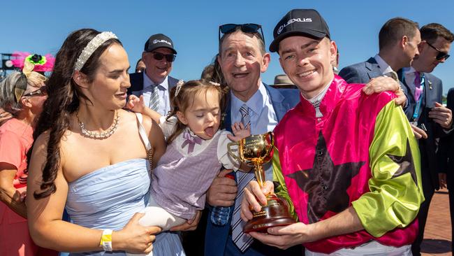 Knight’s Choice jockey Robbie Dolan celebrates with wife Christine, daughter Maisie and father Bobby. Picture: Jason Edwards