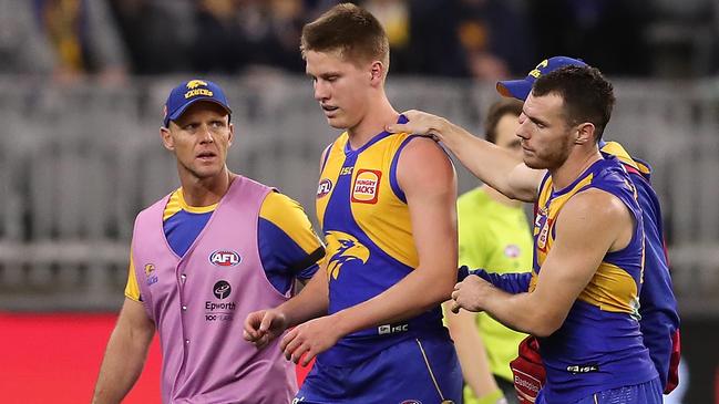 Eagle Harry Edwards is assisted from the field under the concussion rule during a game last season. Picture: Paul Kane/Getty Images