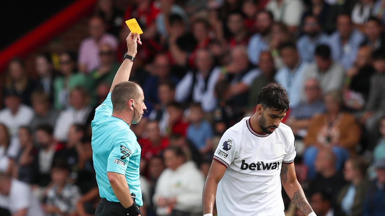 BOURNEMOUTH, ENGLAND - AUGUST 12: Referee Peter Bankes shows a yellow card to Lucas Paqueta of West Ham United during the Premier League match between AFC Bournemouth and West Ham United at Vitality Stadium on August 12, 2023 in Bournemouth, England. (Photo by Henry Browne/Getty Images)