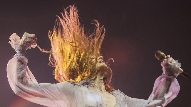 Florence and the Machine frontwoman Florence Welch, giving her all on a hot night at Adelaide’s Botanic Park. Picture Simon Cross/ The Advertiser. 