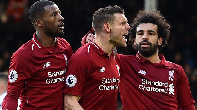 Liverpool's English midfielder James Milner (C) celebrates scoring the team's second goal against Fulham. Picture: Glyn KIRK / AFP