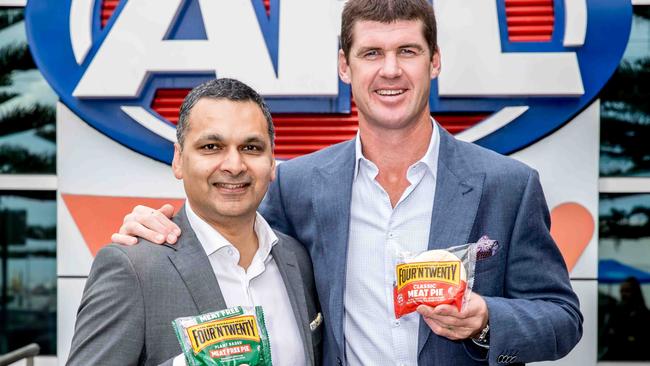 General manager of marketing and innovation Anand Surujpal with former AFL footballer and Four'N Twenty ambassador Jonathan Brown. One-in-three spectators at MCG sporting matches eat a pie, according to Patties Foods.