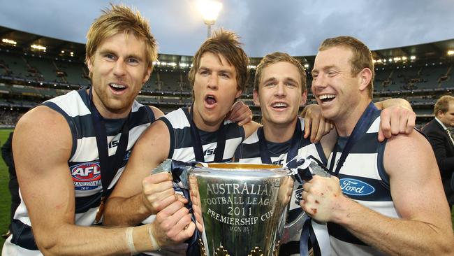 Tom Lonergan, Andrew Mackie, Joel Selwood and Steve Johnson with the 2011 premiership cup.