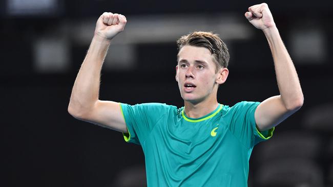 Alex de Minaur celebrates his win over Steve Johnson.