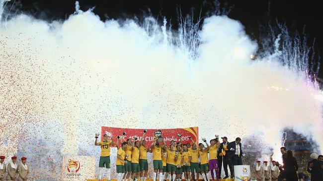 Australia celebrate with the trophy.