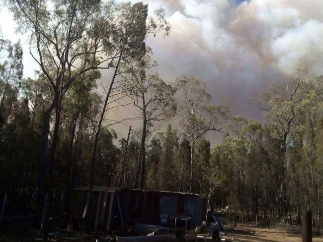 The fire approaches homes at Cypress Gardens. Picture: Douglas Grist