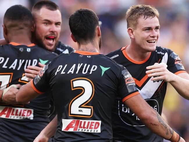 SYDNEY, AUSTRALIA - APRIL 01:  Lachlan Galvin of the Tigers celebrates victory with team mates after the round four NRL match between Parramatta Eels and Wests Tigers at CommBank Stadium, on April 01, 2024, in Sydney, Australia. (Photo by Matt King/Getty Images)