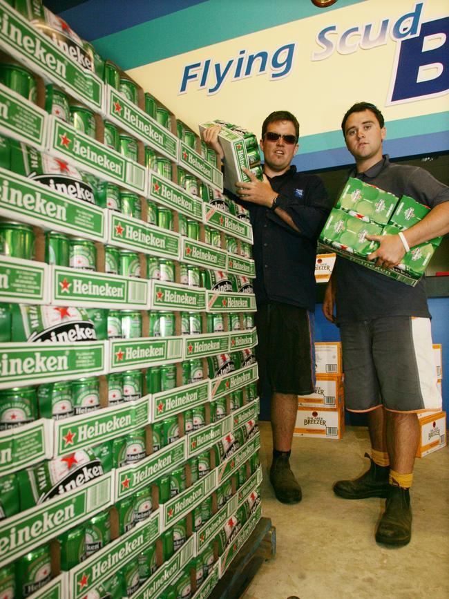Geelong Cup preparations: Matt Smith, left and Craig Isaacs with one of the many beer pallets to unload