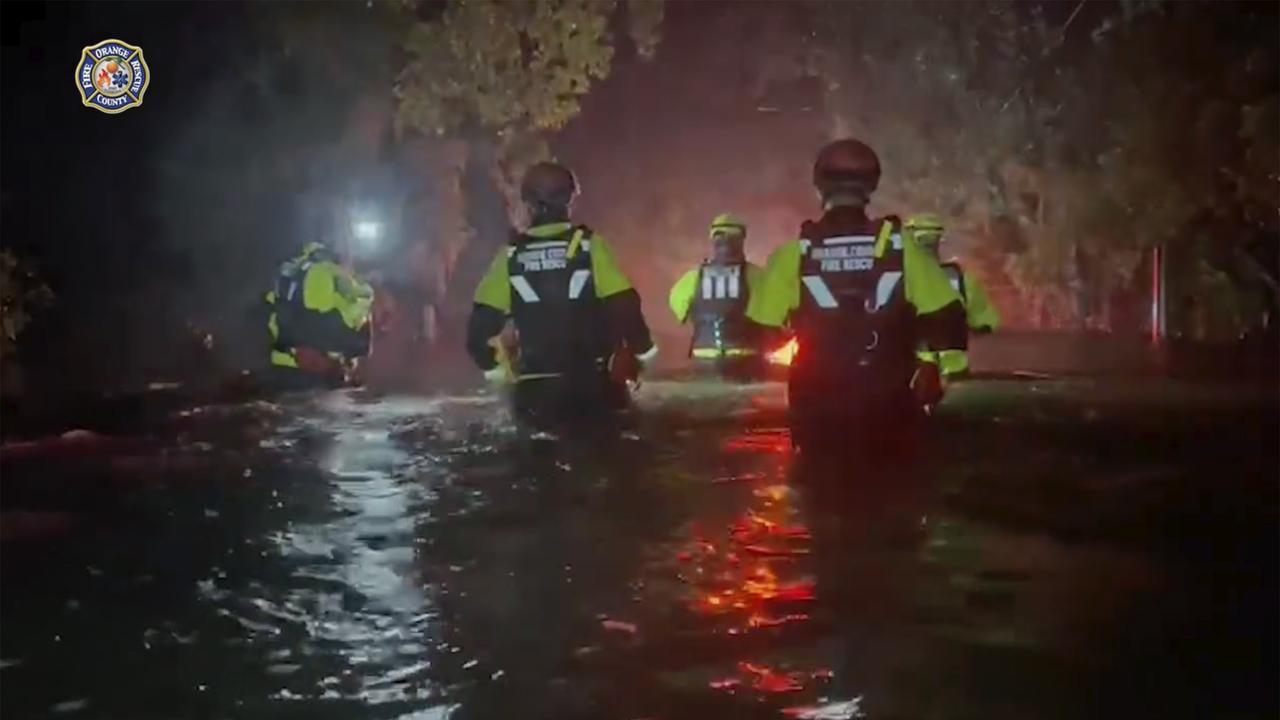 Orange County Fire Rescue Department workers helping people in the early hours of Thursday. Picture: Orange County Fire Rescue Department / AP