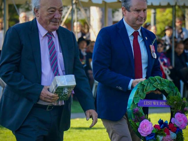 Federal MP Dr Mike Freelander and State MP Greg Warren take part in the wreath-laying ceremony. Picture: Facebook