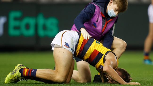 Doedee lies on the ground after the vicious hit in the opening quarter. Picture: AFL Photos via Getty Images