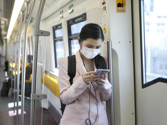 Face masks have become standard on public transport across the world during coronavirus. Picture: Getty Images