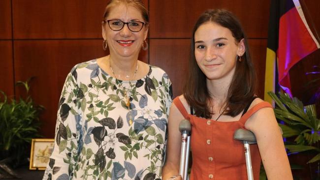 Caitlin O'Neil being presented with a Civic Recognition Award by former Douglas Shire Mayor Julia Leu. Photo: Supplied