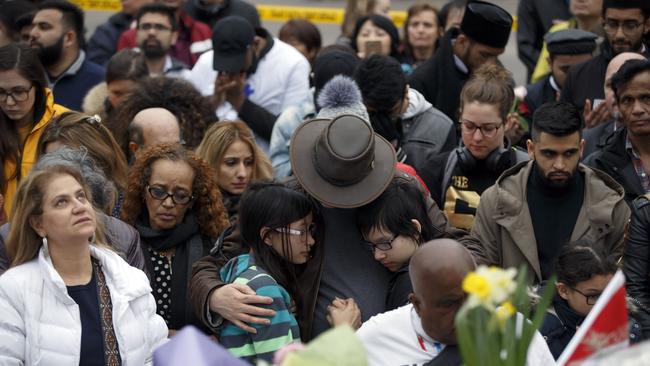 People gather at a memorial for victims of the mass killing. Picture: AFP