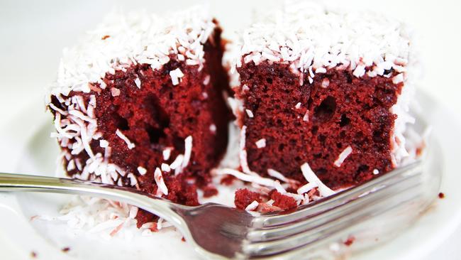 One of the most popular is a ruby red velvet lamington, based on a New York red velvet cake and covered with red chocolate icing. Picture: Braden Fastier