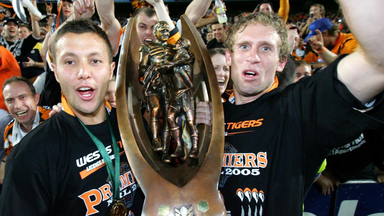 \Scott Prince and Brett Hodgson celebrate the 2005 grand final win.