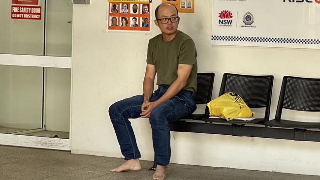 Junming Zhou was released from custody where he sat in Sutherland Police Station wearing no shoes. Picture: Ashleigh Tullis