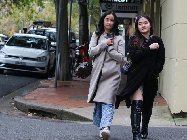 Sydneysiders brave the extreme chilly weather that hit Sydney today as a cold front moves in from the West. Picture: Gaye Gerard