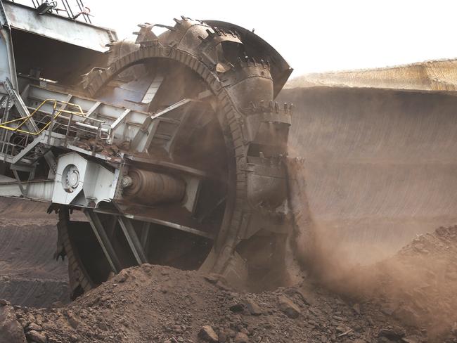 A coal face dredge operating in the brown coal mine. Picture: David Caird