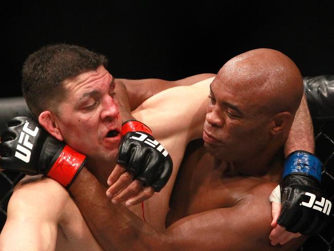 LAS VEGAS, NV - JANUARY 31: Nick Diaz and Anderson Silva fight in their middleweight bout during UFC 183 at the MGM Grand Garden Arena on January 31, 2015 in Las Vegas, Nevada. Silva won by unanimous decision. Steve Marcus/Getty Images/AFP == FOR NEWSPAPERS, INTERNET, TELCOS & TELEVISION USE ONLY ==