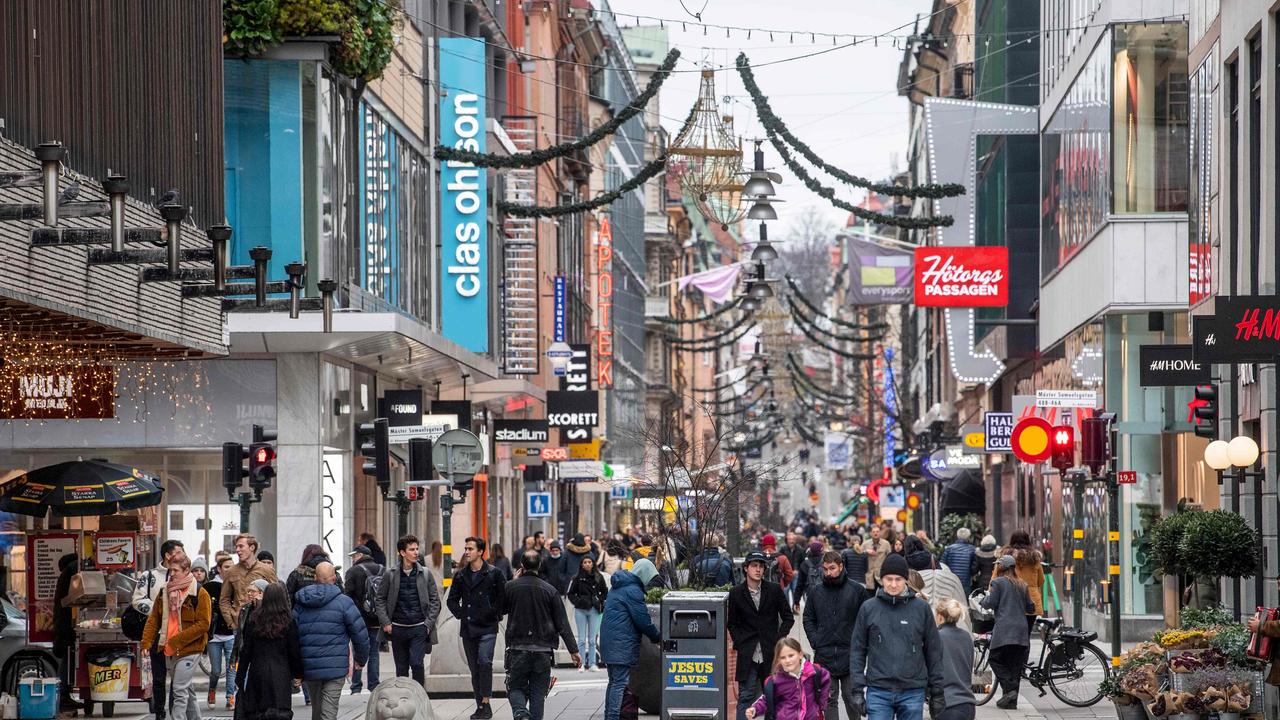 People stroll along the Drottninggatan shopping street in central Stockholm during the pandemic. Picture: AFP