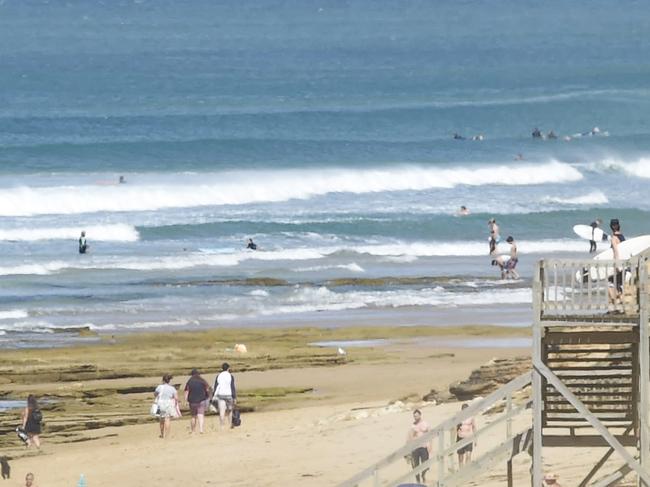 Surf's up! Where do you go when the cricket is called off. Thirteenth Beach between the Hole and Beacon was pumping as locals and holiday makers fled to the beach. 11am the beach was 37 degrees and rising. Hot northerly winds held the surf up. Spread on people surviving the heat. Picture: Alan Barber