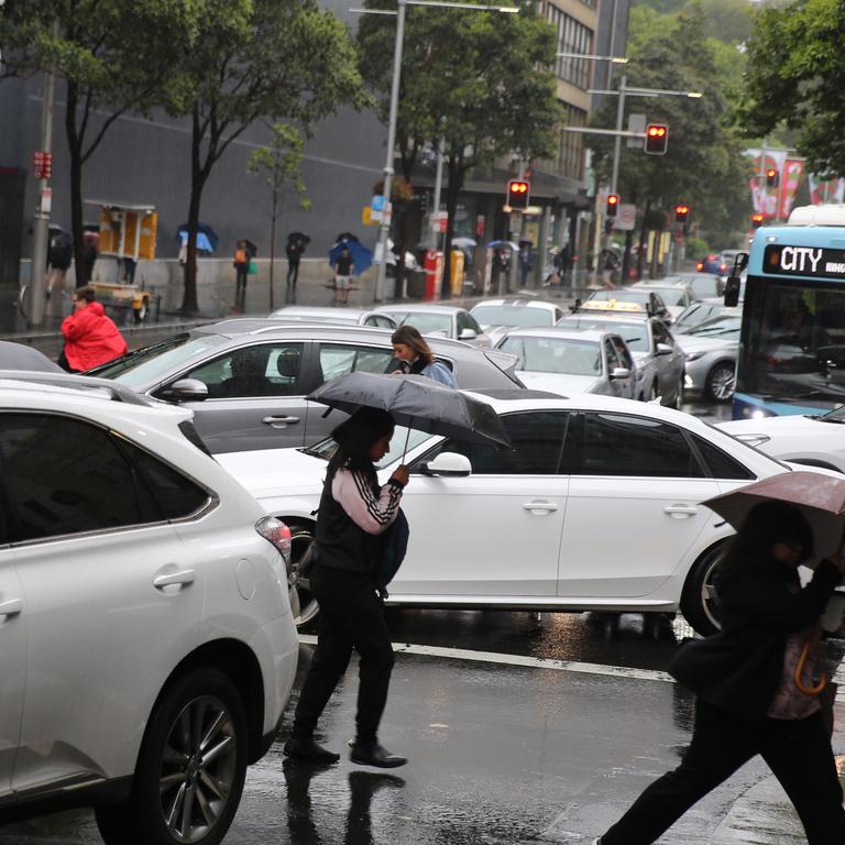 As The low hits Sydney people around town hall .picture John Grainger