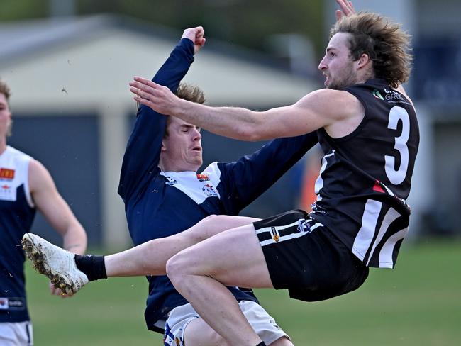 BFL: Darley’s Dylan Landt collides with a Melton South defender. Picture: Andy Brownbill