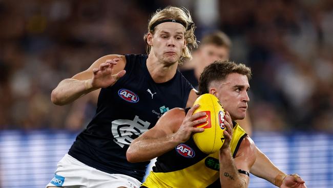 De Koning (left) was able to continue after the bump. (Photo by Michael Willson/AFL Photos via Getty Images)