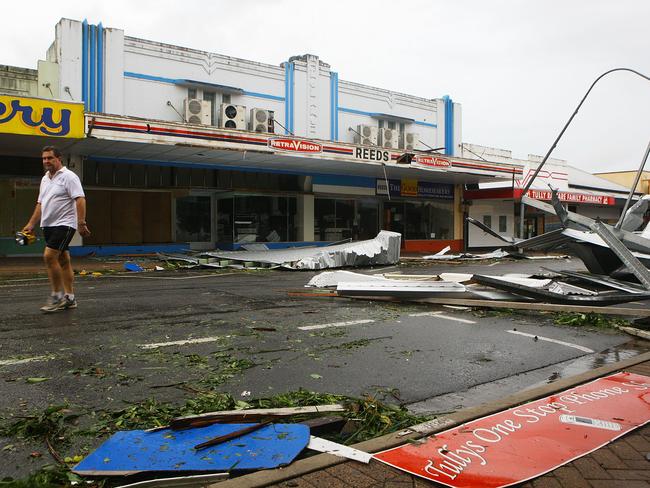 A local resident walks through the main street of Tully in 2011 after Cyclone Yasi. Picture: Getty