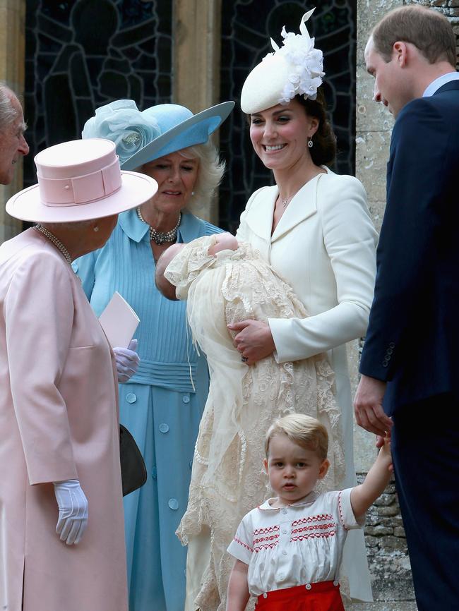 Catherine, Duchess of Cambridge, Prince William, Duke of Cambridge, Princess Charlotte of Cambridge and Prince George of Cambridge talk to Queen Elizabeth II, Prince Phillip, Duke of Cambridge and Camilla, Duchess of Cornwall arrive at the Church of St Mary Magdalene on the Sandringham Estate for the Christening of Princess Charlotte of Cambridge on July 5, 2015 in King’s Lynn, England. Picture: Getty