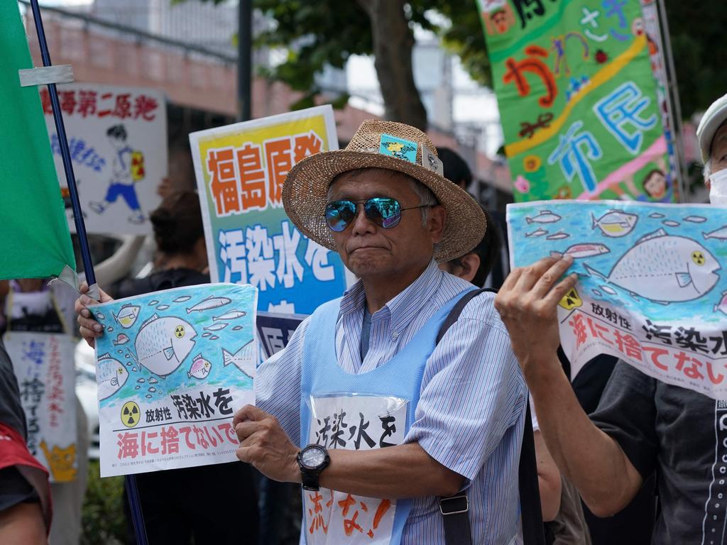 Protesters outside the Tokyo Electric Power Company (TEPCO) headquarters in Tokyo. (Photo by Kazuhiro NOGI / AFP)