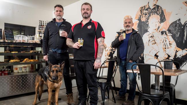 Number 3: John McNeill from the Aussie Veterans Coffee Co in Boronia (centre), with fellow vets Ben Pullin, his dog Shiloh and Sean Burton. Picture: Jake Nowakowski